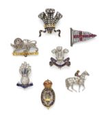 GROUPE DE SEPT BROCHES REGIMENTAL EN OR, ARGENT, PLATINE, ÉMAIL, RUBIS, SAPHIRS ET DIAMANTS