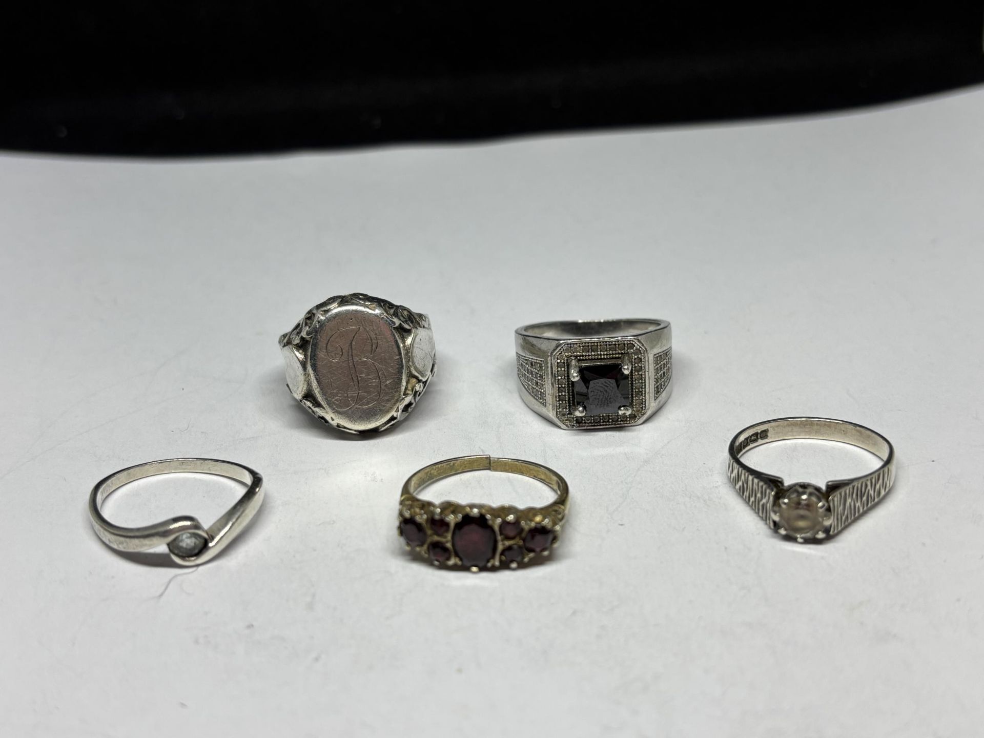 FIVE MARKED SILVER RINGS