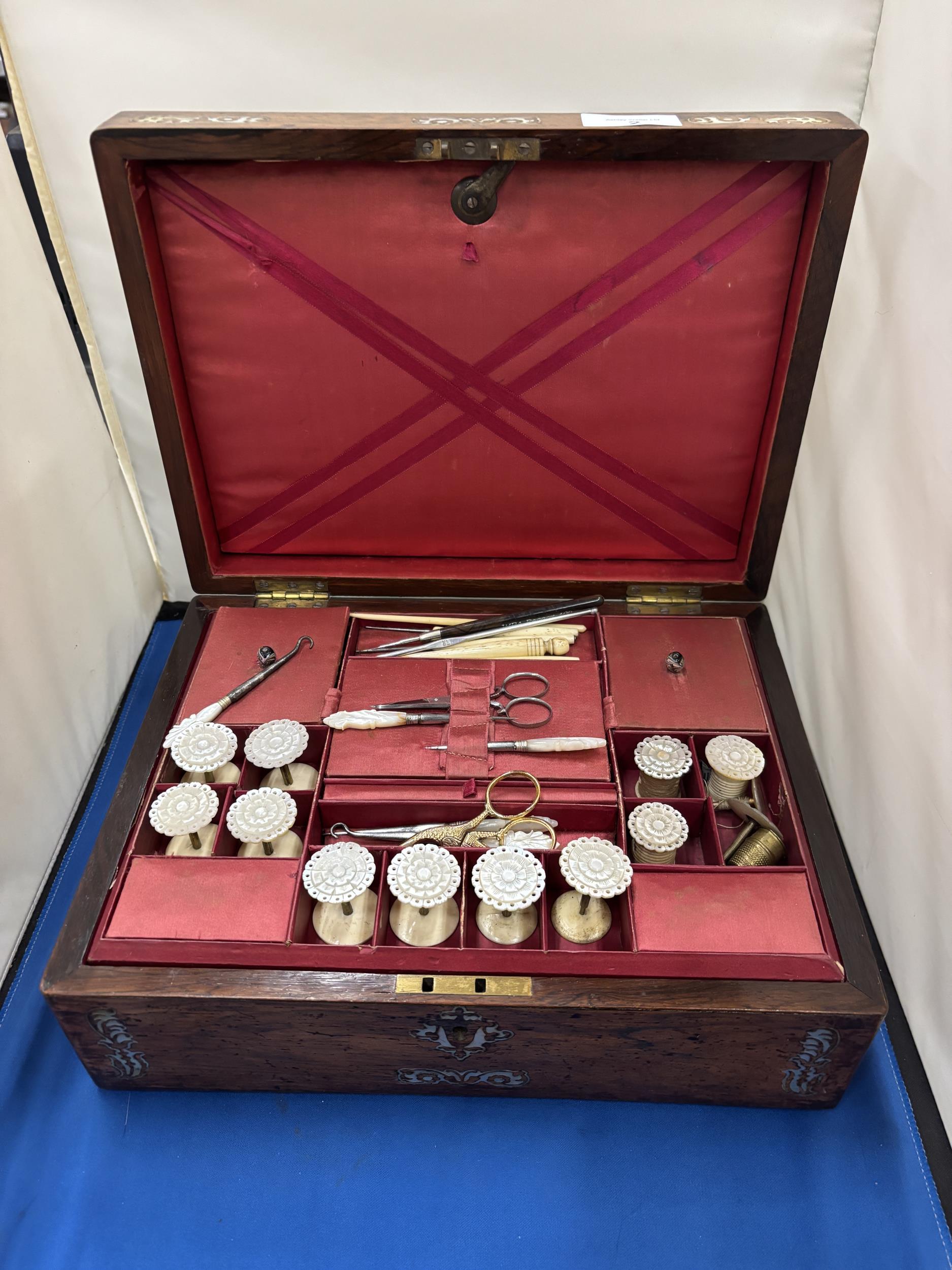 A LATE 19TH CENTURY ROSEWOOD WITH INLAND MOTHER OF PEARL SEWING BOX WITH LIFT OUT LID CONTAINING