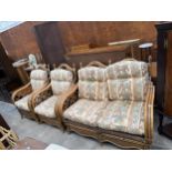 A WICKER AND BAMBOO EFFECT THREE PIECE CONSERVATORY SUITE