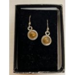A PAIR OF SILVER AND AMBER EARRINGS