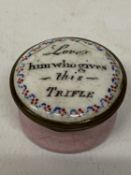 AN ANTIQUE BILSTON ENAMEL PILL BOX WITTH INSCRIPTION 'LOVE HIM WHO GIVES THIS TRIFLE'