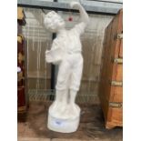 A CHALK FIGURE OF A YOUNG MALE WITH A BASKET OF FRUIT