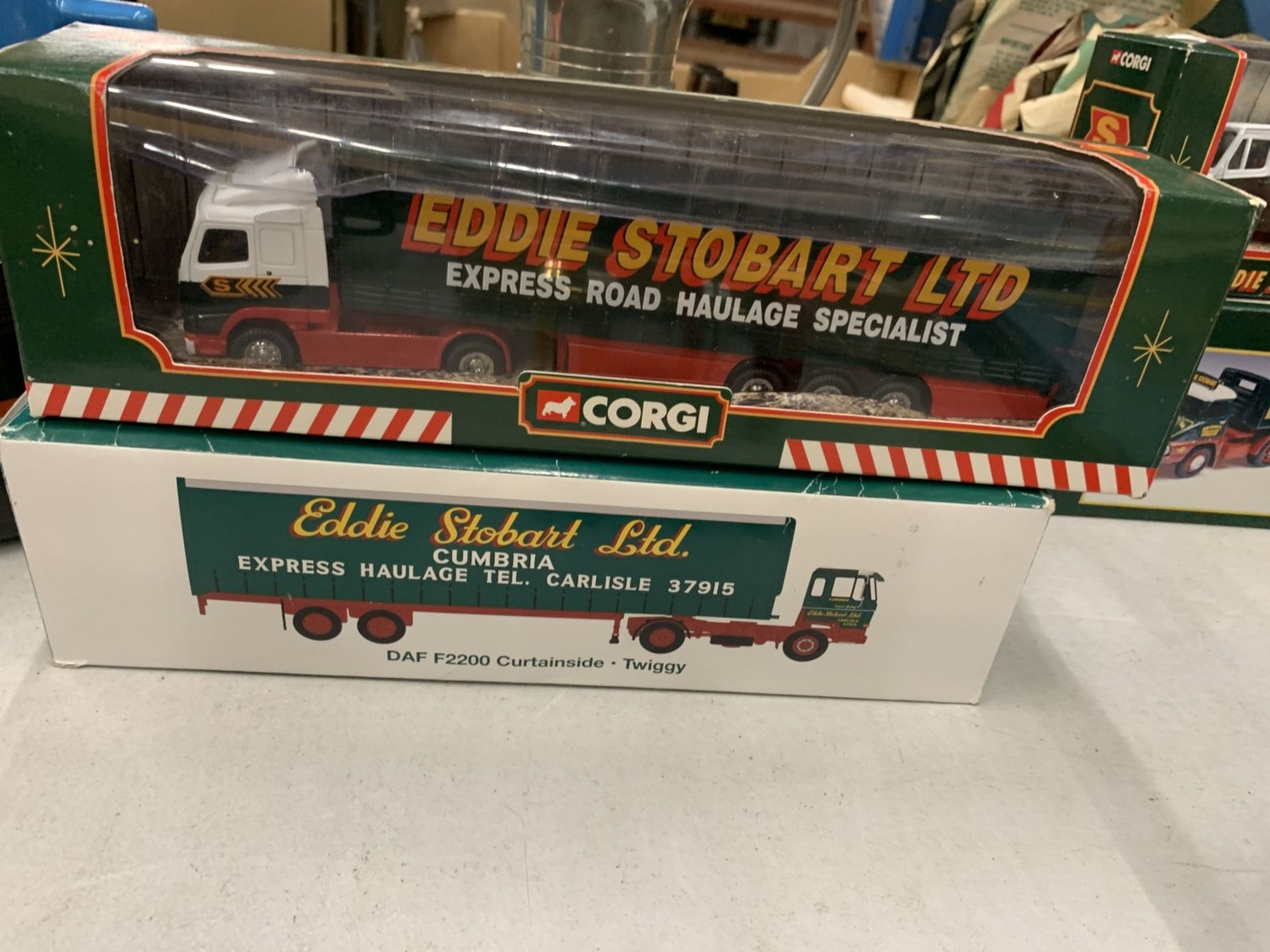 TWO BOXED EDDIE STOBART CURTAINSIDE LORRIES