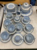 A WEDGWOOD EMBOSSED QUEEN'S WARE POWDER BLUE TEASET TO INCLUDE A TEAPOT, CAKE PLATE, SANDWICH PLATE,