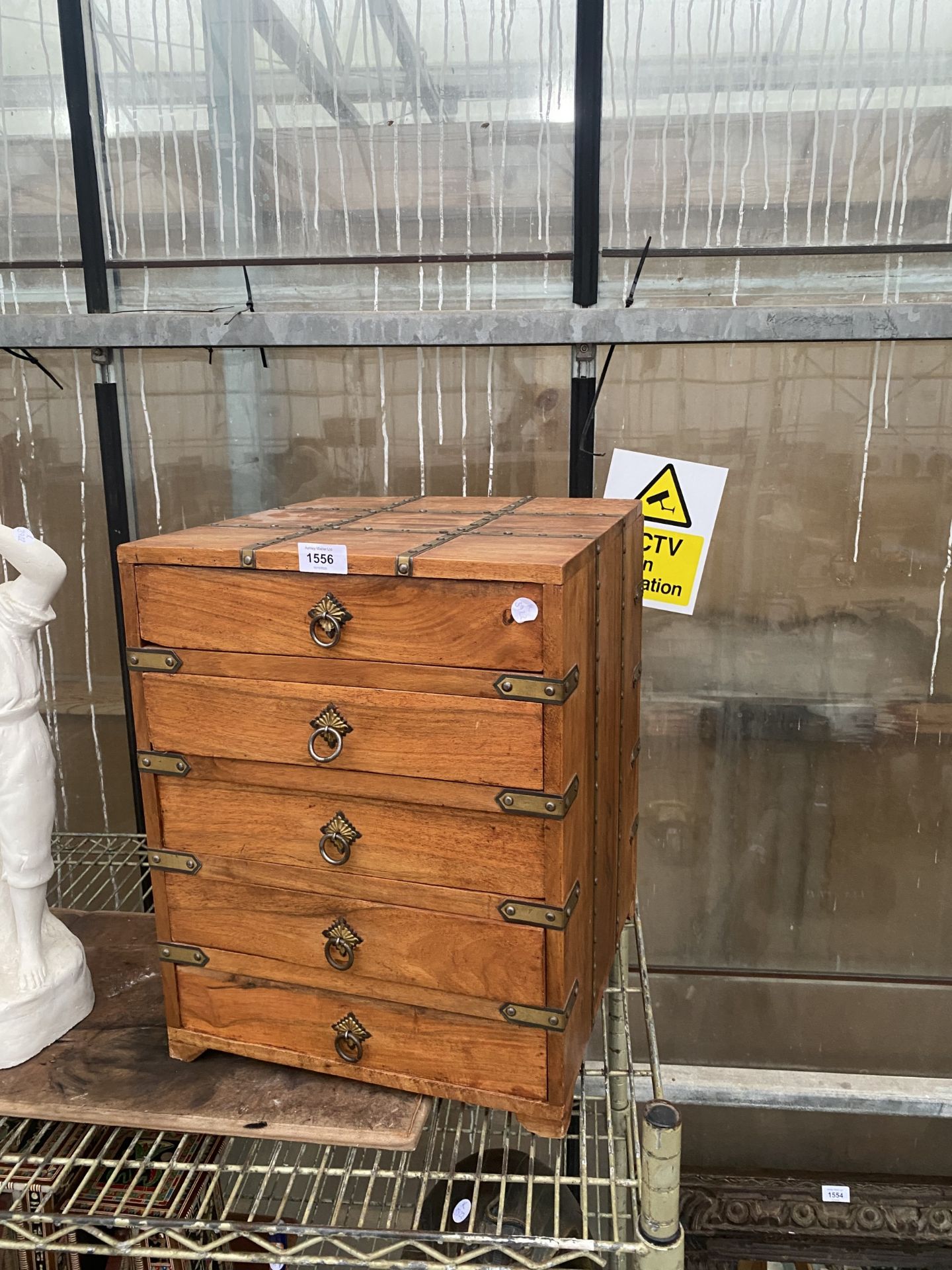 A MINIATURE HARDWOOD CHEST OF FIVE DRAWERS WITH BRASS DETAIL