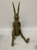 A LARGE ARTICULATED TREEN RABBIT, HEIGHT 69CM