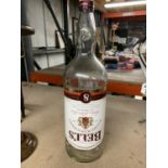 A LARGE VINTAGE GALLON BELLS WHISKY BOTTLE
