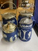 FOUR PIECES OF DARK BLUE WEDGWOOD JASPERWARE TO INCLUDE BISCUIT BARRELS, AJUG, ETC ALL WITH METAL