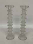 A PAIR OF CLEAR GLASS LITTALA FESTIVO CANDLESTICKS DESIGNED BY TIMO SARPANEVA