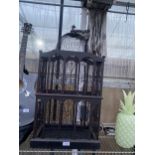 A DECORATIVE WOODEN BIRD CAGE
