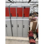 A THREE SECTION METAL LOCKER UNIT