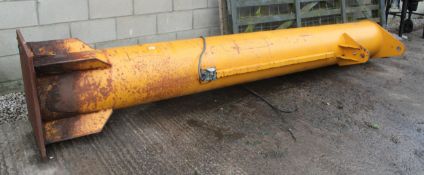 A LARGE YELLOW ELECTRIC CRANE + FRAME & TRACTOR TYRE