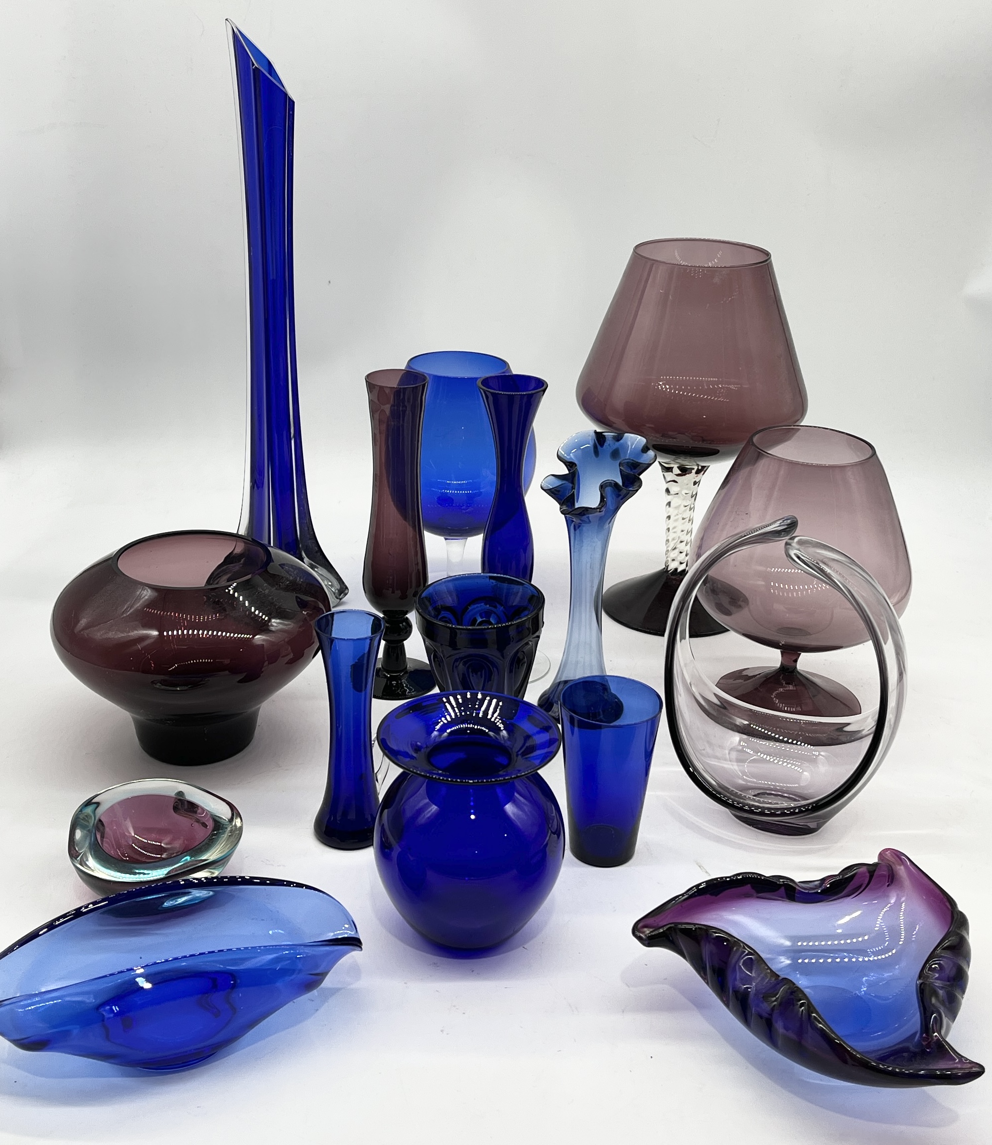 A collection of various art glass including Bristol blue vase, oversized glasses etc.