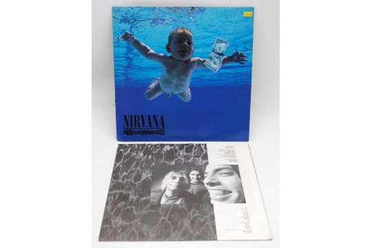 Two 12" vinyl record albums by Nirvana, including 'Bleach' and 'Nevermind', both with original inner - Image 16 of 28