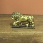 A Cast Gilt Bronze Figure of a Lion Circa 1700