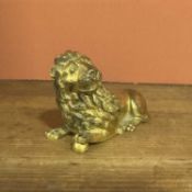 A chased and gilt-bronze figure of a recumbent lion Italy, 16th Century