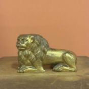A hollow-cast chased and gilt bronze figure of a recumbent lion Italy ,15th Century