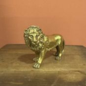 A parcel-gilt and chased bronze figure of a lion Circa 1700