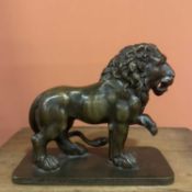A cast patinated bronze figure of a lion Circa 1700