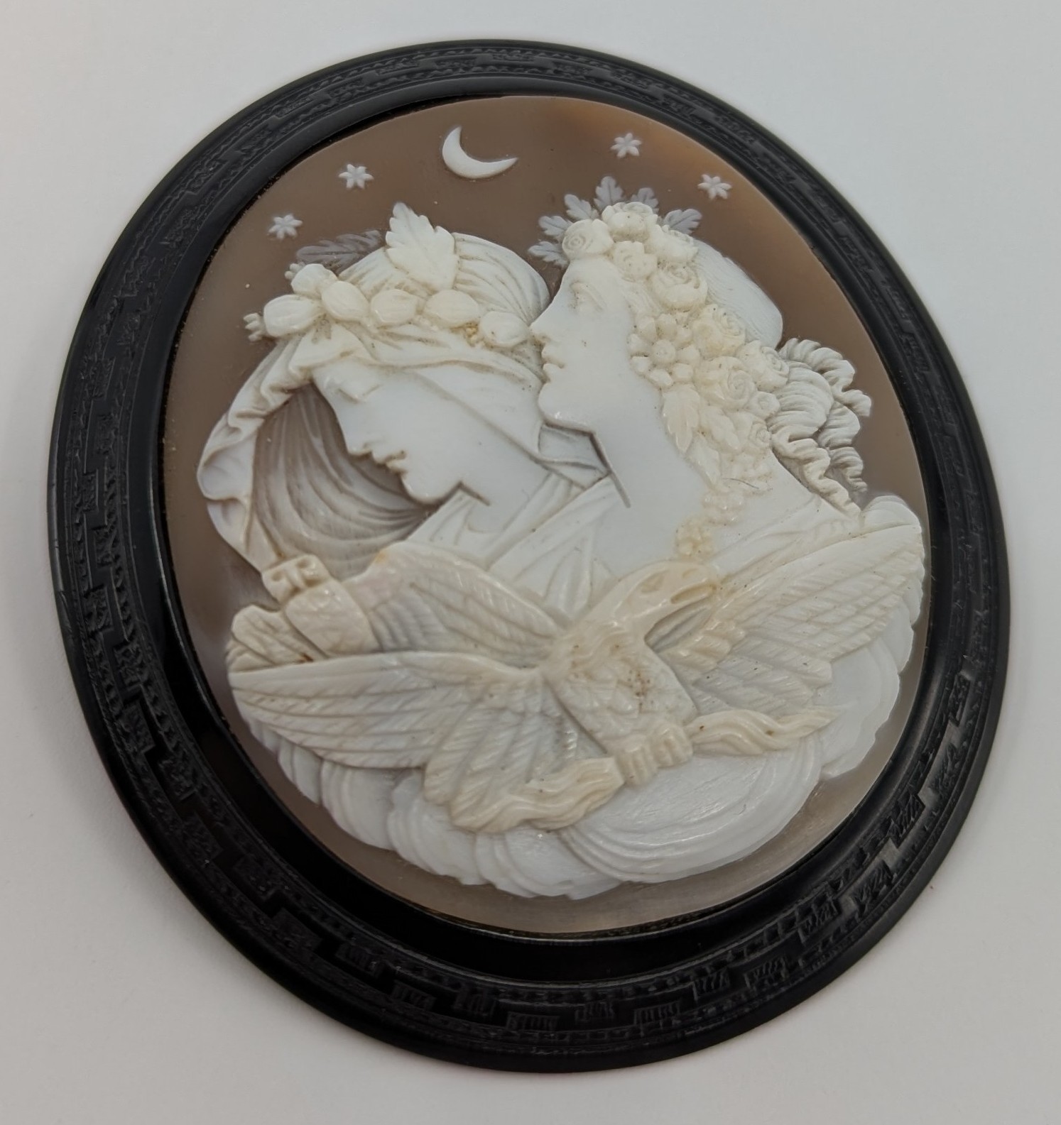 Shell Cam Designs A Victorian carved oval shell cameo and black onyx brooch, the brooch ...