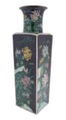 A Chinese famille noire square-section vase painted with chrysanthemum sprays, bamboo,