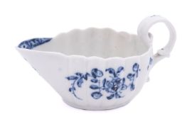 A Champion's Bristol blue and white creamboat of lobed form with scroll handle,
