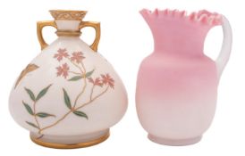 A Royal Worcester porcelain two handled vase decorated and gilded with blooms and butterflies on an