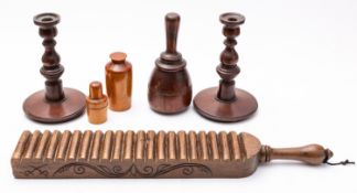 A collection of treen works of art, comprising a Victorian carved walnut laundry paddle,