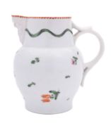 A Champion's Bristol mask jug painted with flower sprays and sprigs below a wavy band of green