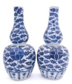 A pair of Chinese blue and white double gourd vases,