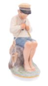 A Royal Copenhagen porcelain figure 'Boy cutting stick' modelled after the original by Christian
