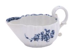 A Champion's Bristol blue and white creamboat of oval lobed form,