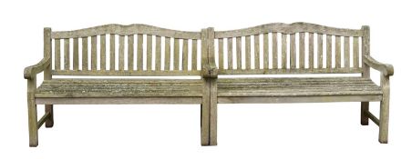 A set of three teak garden benches,