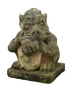 A stone composition garden model of a grotesque, probably by Haddonstone,