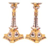 A pair of Royal Crown Derby candlesticks, boxed.