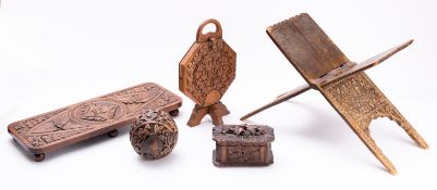 A group of seven pieces of treen, 19th/20th century including two trays, a small casket,