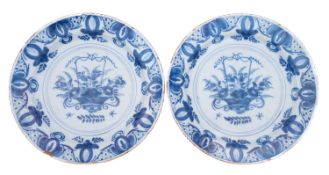 A pair of Dutch Delft pottery chargers,