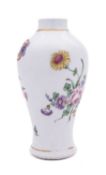 A Plymouth baluster vase painted in bright enamels with a loose bouquet of flowers,