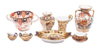 A mixed group of Royal Crown Derby porcelain in the Imari pattern, comprising a miniature cup,