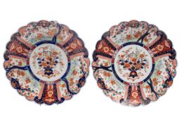 A pair of Imari porcelain chargers of scalloped circular form,