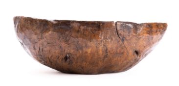 A large burr walnut bowl, probably 19th century; rough hewn from a solid piece,