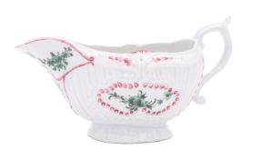 A Champion's Bristol strap-moulded sauceboat painted in green camaieu with garlands and flower
