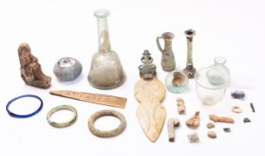 A collection of glass, pottery and stone artefacts,