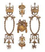 A pair of French gilt-brass door plates and two similar mounts cast in neo-classical style with