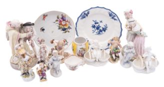 A mixed group of porcelain figures, including a Meissen Boy with Bagpipes, on a square base,