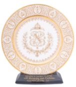 A Sèvres Napoleon III plate decorated in gilt with the Royal cypher within a laurel wreath and