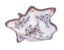 A Plymouth leaf-shaped pickle dish painted in underglaze blue and iron-red enamels with flower