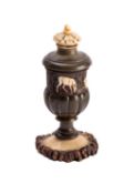 A Continental carved antler spice box in the form of a lobed vase and screw cover, 19th century, 9.