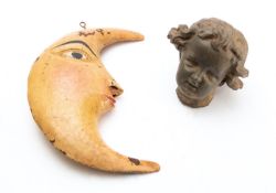 A Continental spelter model of the head of a child,